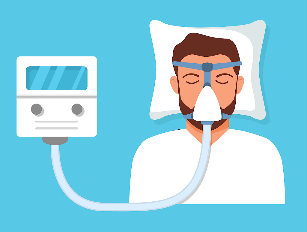 Yöllisiä hengityskatkoksia voidaan estää CPAP-laitehoidolla.